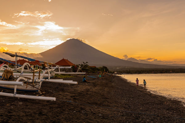 amed beach with mt agung at sunset